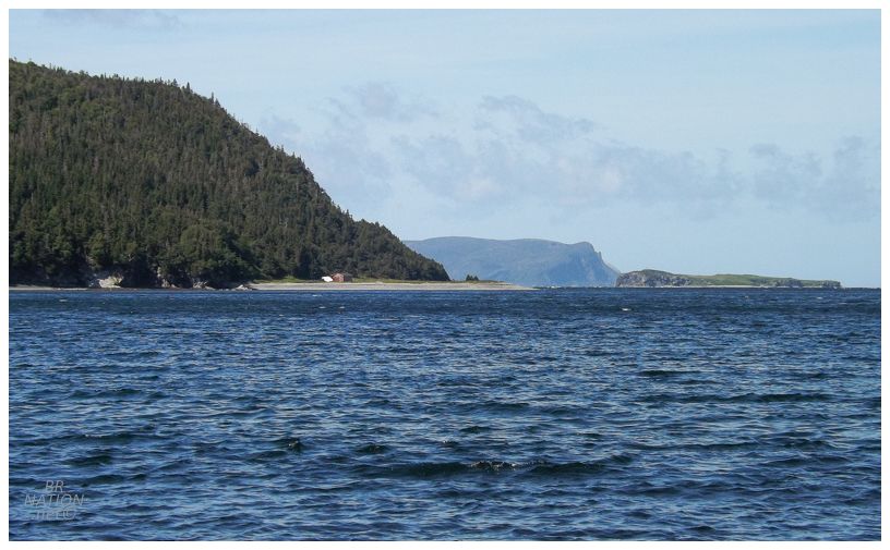 walking back and a zoomed view of that one cabin further up the bay from brakes cove